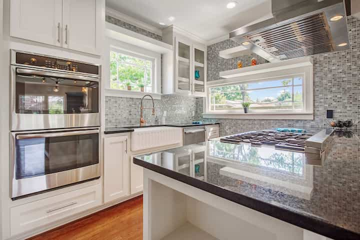 An image of a modern kitchen with sleek appliances, featuring a gas stove, refrigerator, and built-in microwave in Waco